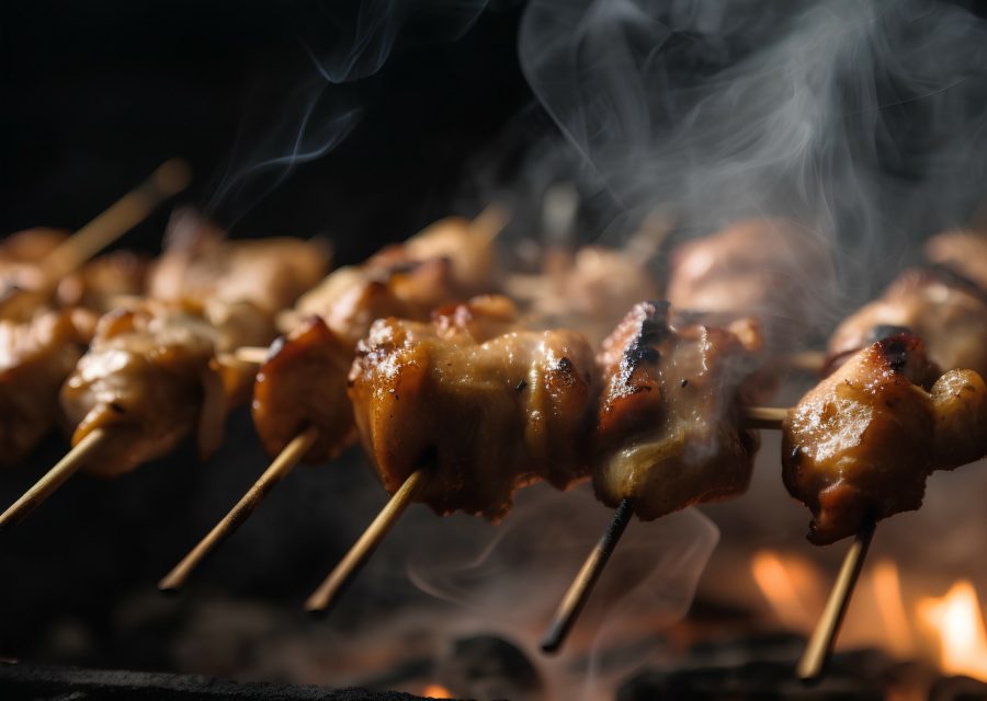 Grilled chicken skewers on a barbecue. Selective focus.